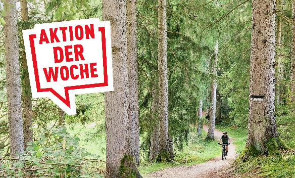 Ein Radfahrer im Wald – darüber eine Sprechblase mit dem Text "Aktion der Woche"