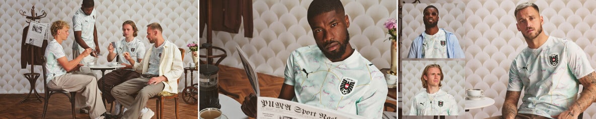 Österreichische Fußballspieler im neuen Auswärtstrikot posieren in einem Kaffeehaus.