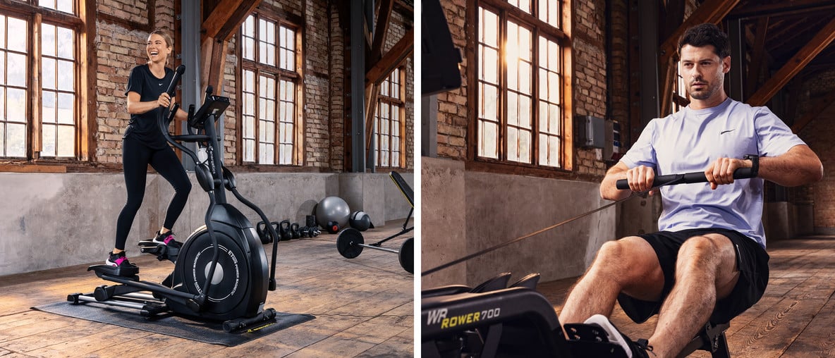 Frau trainiert auf einem Crosstrainer und Mann auf einem Rudergerät in einem Fitnessraum mit Backsteinwänden