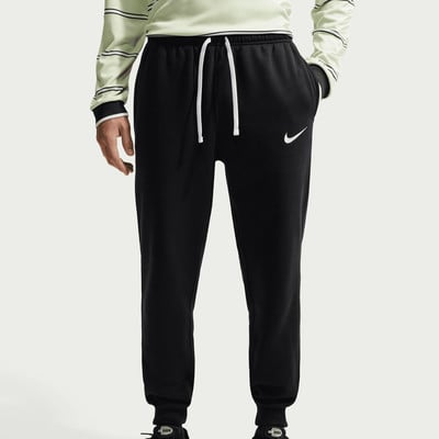 Schwarze Nike Jogginghose mit weißem Kordelzug und Logo auf dem Oberschenkel. Schwarze Nike Jogginghose mit weißem Kordelzug und Logo auf dem Oberschenkel.