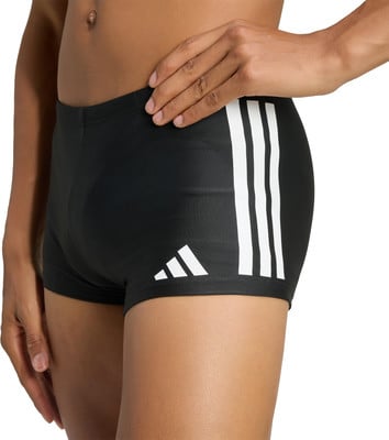 Černé plavky Adidas s bílými pruhy a logem. Černé plavky Adidas s bílými pruhy a logem.