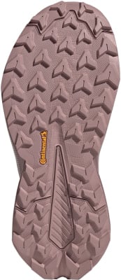 Laufschuhsohle in Rosa mit ausgeprägtem Profil und Continental-Logo. Laufschuhsohle in Rosa mit ausgeprägtem Profil und Continental-Logo.