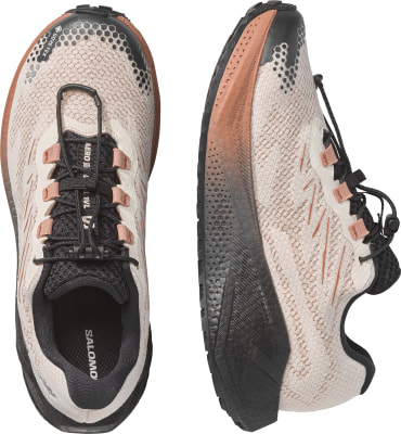 Rosa Salomon Trailrunning-Schuhe mit schwarzer Sohle und Schnellverschluss. Rosa Salomon Trailrunning-Schuhe mit schwarzer Sohle und Schnellverschluss.