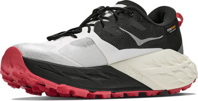 Schwarz-weißer Laufschuh mit roter Sohle und grauen Details. Schwarz-weißer Laufschuh mit roter Sohle und grauen Details.