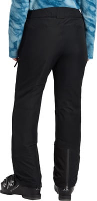 Schwarze Skihose mit blauem Fleeceoberteil und Skischuhen. Schwarze Skihose mit blauem Fleeceoberteil und Skischuhen.