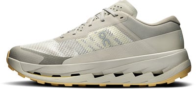 Grauer Laufschuh mit beiger Sohle und weißer Naht. Grauer Laufschuh mit beiger Sohle und weißer Naht.