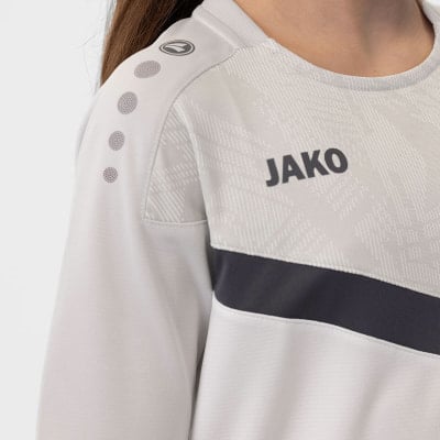 Mädchen-Sweatshirt von JAKO mit Logo und Punkten auf dem Ärmel.
