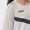 Mädchen-Sweatshirt von JAKO mit Logo und Punkten auf dem Ärmel.