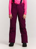 Mädchen lila Skihose mit Latz und pinkem Oberteil.