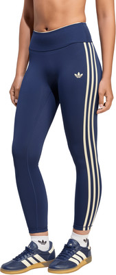 Damen-Leggings von Adidas in Dunkelblau mit Beige-Streifen und Logo. Damen-Leggings von Adidas in Dunkelblau mit Beige-Streifen und Logo.