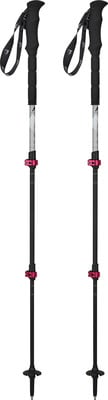 Zwei schwarze Trekkingstöcke mit rosa Schnallen und Schlaufen. Zwei schwarze Trekkingstöcke mit rosa Schnallen und Schlaufen.