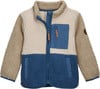 Eine beigefarbene und blaue Fleecejacke mit Reißverschlusstasche und braunen Details.