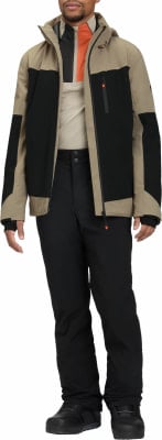 Mann in einer beigen und schwarzen Skijacke mit orangefarbenen Akzenten und schwarzer Hose. Mann in einer beigen und schwarzen Skijacke mit orangefarbenen Akzenten und schwarzer Hose.
