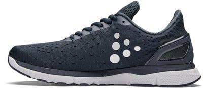 Dunkelblauer Laufschuh mit weißen Kreisen an der Seite. Dunkelblauer Laufschuh mit weißen Kreisen an der Seite.