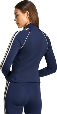 Dunkelblaue Damenjacke mit Streifen an den Ärmeln und Leggings. Dunkelblaue Damenjacke mit Streifen an den Ärmeln und Leggings.