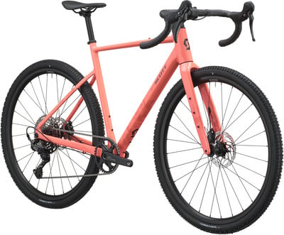 Ein rosafarbenes Scott Gravelbike mit schwarzen Rädern und schwarzem Sattel. Ein rosafarbenes Scott Gravelbike mit schwarzen Rädern und schwarzem Sattel.