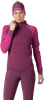Frau in pinker Sportbekleidung mit Dynafit-Stirnband.