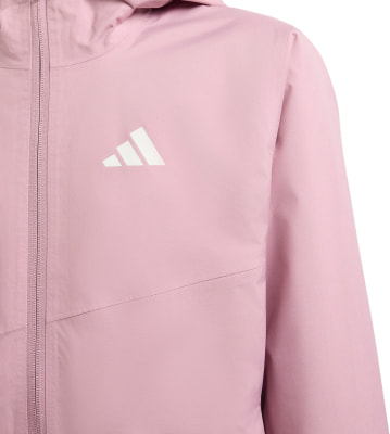 Eine rosa Jacke mit weißem Adidas-Logo auf der Brust und Reißverschluss. Eine rosa Jacke mit weißem Adidas-Logo auf der Brust und Reißverschluss.