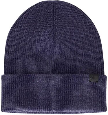 Dunkelblaue Strickmütze mit Umschlag und schwarzem Label. Dunkelblaue Strickmütze mit Umschlag und schwarzem Label.