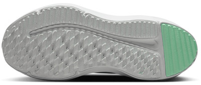 Schuhsohle mit strukturierter Lauffläche und grünem Bereich für besseren Grip.