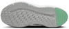 Schuhsohle mit strukturierter Lauffläche und grünem Bereich für besseren Grip.