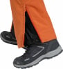 Orange Hose mit Reißverschluss und schwarzen Stiefeln.