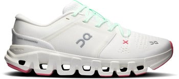 Weiße Laufschuhe mit mintgrünen Schnürsenkeln und rosa Akzenten.