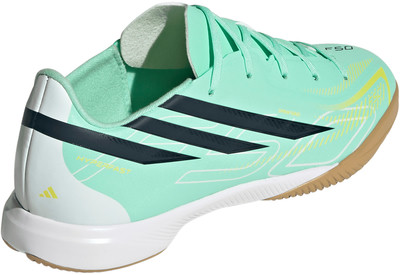 Grüner Adidas Fußballschuh mit dunkelblauen Streifen und gelben Akzenten. Grüner Adidas Fußballschuh mit dunkelblauen Streifen und gelben Akzenten.