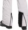 Skihose mit seitlichen Reißverschlüssen und Skischuh.