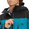 Mann in einer blauen und schwarzen McKinley-Jacke, schließt den Reißverschluss.