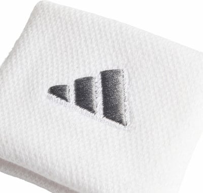 Weißes Adidas-Armband mit drei grauen Streifen. Weißes Adidas-Armband mit drei grauen Streifen.