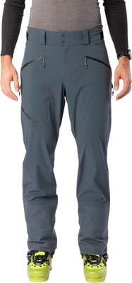 Ein Mann in dunkelgrauer Skihose und gelben Skischuhen. Ein Mann in dunkelgrauer Skihose und gelben Skischuhen.