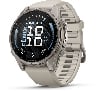 Graue Garmin Fenix Smartwatch mit beigem Armband und Zifferblatt.