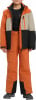 Kind in orangefarbener Skihose und Jacke mit schwarzen und beigen Details.
