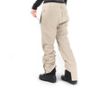 Beige Skihose mit schwarzem Schuh und verstellbaren Hosenbeinen.