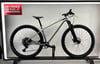 Silbernes Mountainbike mit schwarzen Rädern und FIRMEN RADL.AT Logo