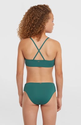 Mädchen in dunkelgrünem Bikini mit gekreuzten Trägern am Rücken. Mädchen in dunkelgrünem Bikini mit gekreuzten Trägern am Rücken.