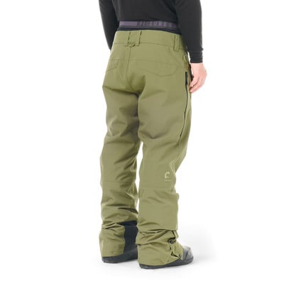 Grüne Skihose mit Logo am Bein und schwarzen Stiefeln. Grüne Skihose mit Logo am Bein und schwarzen Stiefeln.
