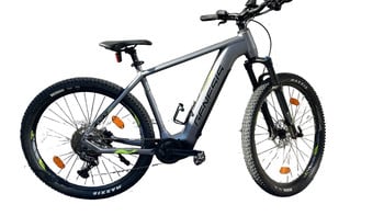 Graues E-Bike mit schwarzen Rädern und gelben Details am Rahmen.