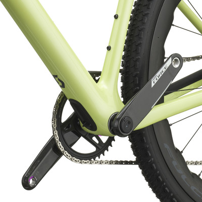 Detail der Kurbel und des Kettenblatts an einem hellgrünen Fahrrad. Detail der Kurbel und des Kettenblatts an einem hellgrünen Fahrrad.