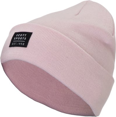 Eine rosa Strickmütze mit schwarzem Scott Sports Est. 1958 Patch. Eine rosa Strickmütze mit schwarzem Scott Sports Est. 1958 Patch.