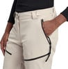 Detail einer Damen-Skihose in Beige mit Tasche und Reißverschluss.