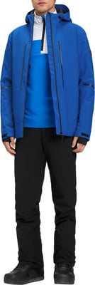 Mann in blauer Skijacke und schwarzer Hose. Mann in blauer Skijacke und schwarzer Hose.