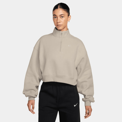 Damen-Sweatshirt von Nike in Beige mit kurzem Reißverschluss.