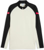 Beigefarbener Puma-Pullover mit schwarzen Ärmeln und pinkem Logo.