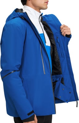 Ein Mann in einer blauen Jacke mit einem weiß-blauen Hemd darunter. Ein Mann in einer blauen Jacke mit einem weiß-blauen Hemd darunter.