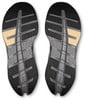 Schuhsohle mit Wabenmuster und beigen Elementen.