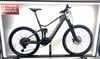 Graues Merida Mountain E-Bike mit Federung und FIRMEN RADL.AT Logo.