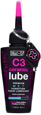 Flasche mit pinkem Verschluss und Muc-Off C3 Ceramic Lube Kettenöl. Flasche mit pinkem Verschluss und Muc-Off C3 Ceramic Lube Kettenöl.