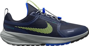 Blauer Nike Laufschuh mit neongrünem Swoosh und grauer Sohle.